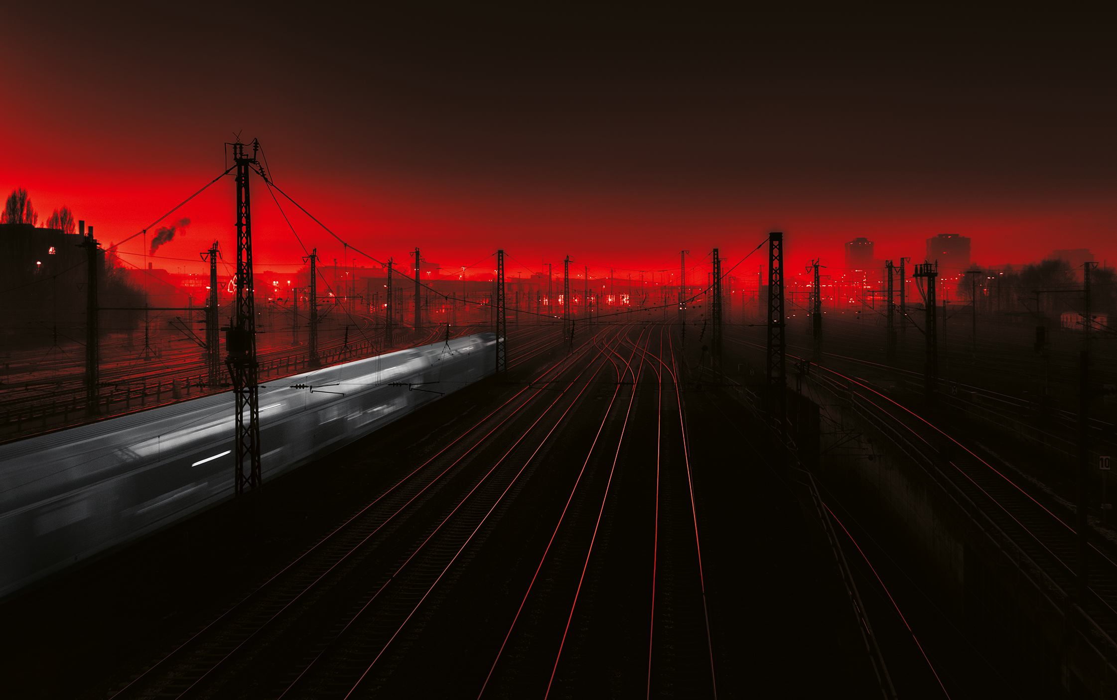 railroad tracks in foggy Munich at sunset